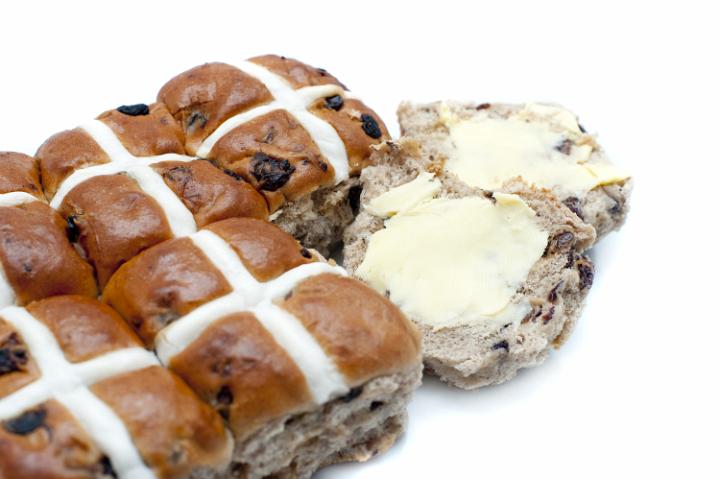 good_friday_bun.jpg - Batch of spicy Easter Hot Cross Buns with one sliced and buttered ready to eat